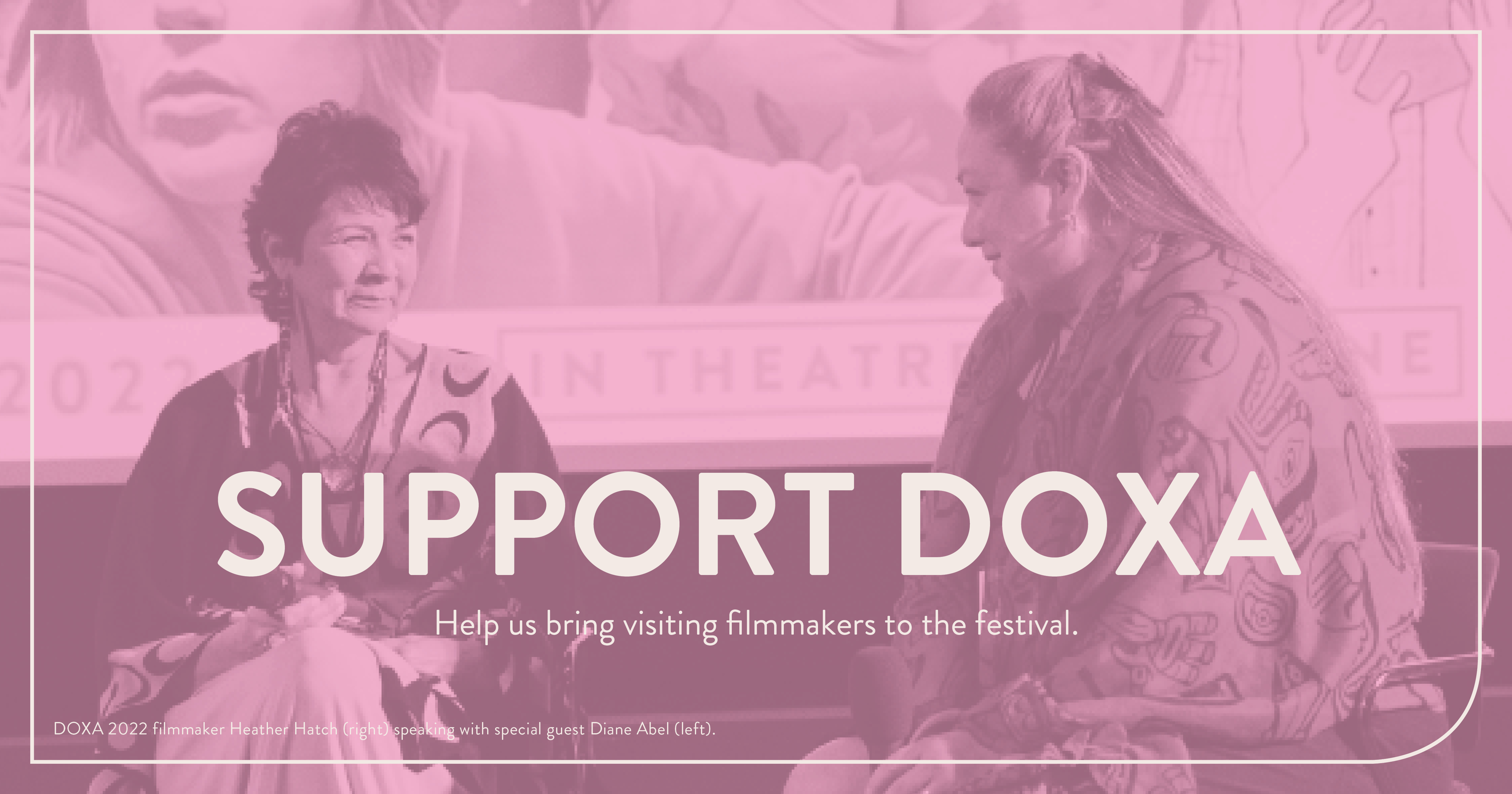 A photograph of two Indigenous looking at each other and smiling, with the DOXA 2022 key art on the theatre screen behind them. The image is tinted pink, with white text overtop that reads: SUPPORT DOXA